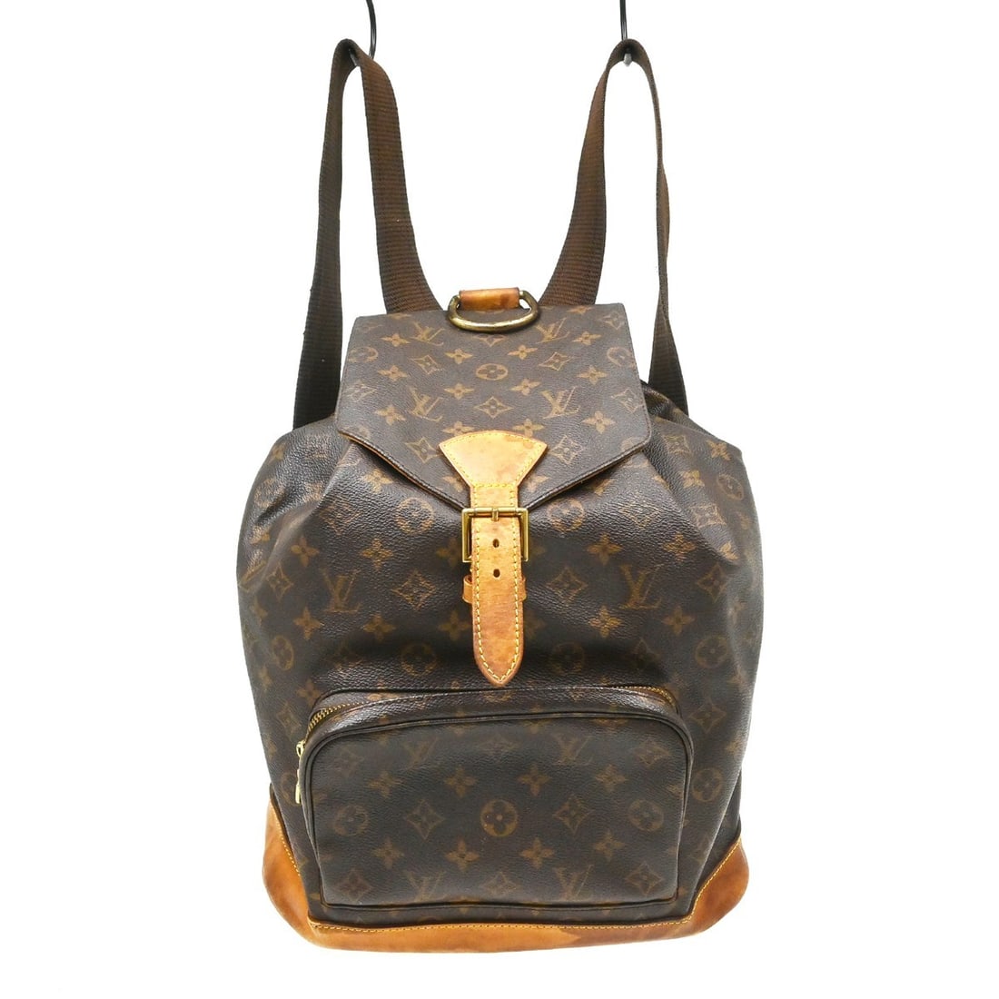 Louis Vuitton Montsouris GM Monogram Canvas Backpack: Louis Vuitton Montsouris GM Monogram Canvas Backpack This Louis Vuitton Montsouris GM backpack features the iconic monogram canvas and leather exterior, complemented by beige straps and brown lining. 