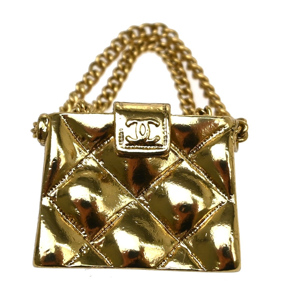 Chanel Gold Tone Logo Brooch Pin 02P: Chanel Gold Tone Logo Brooch Pin 02P This Chanel brooch features the iconic logo design in a gold-tone finish. Crafted in France, it showcases the brand's signature elegance and style. The brooch is i