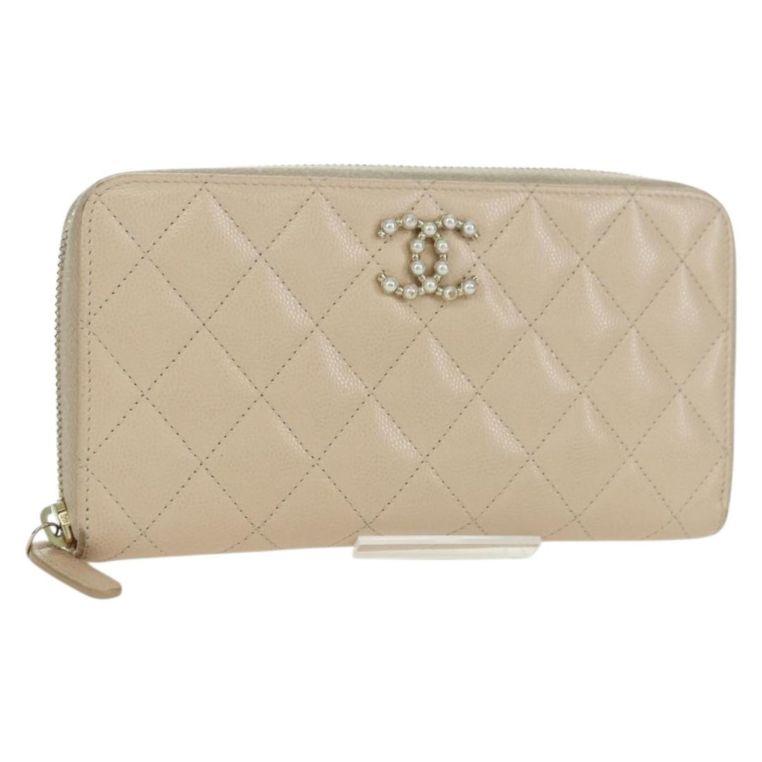 Beige Lambskin Long Wallet by CHANEL with Gold CC Logo and Dust Bag: Beige Lambskin Long Wallet by CHANEL with Gold CC Logo and Dust Bag This CHANEL long wallet features luxurious beige lambskin leather with gold-tone accents. Designed for women, it offers a spacious i