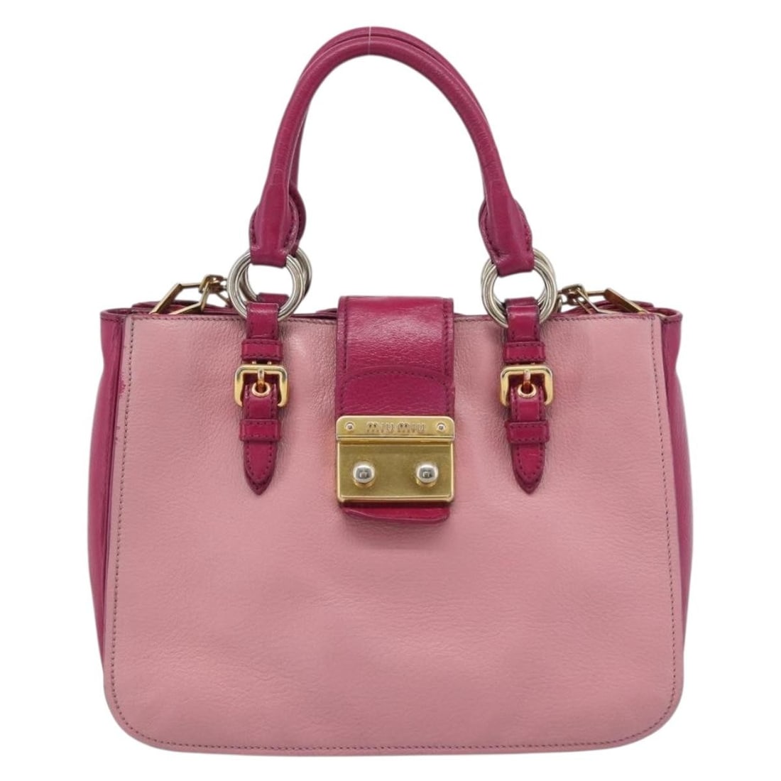 Miu Miu Madras pink leather convertible lock tote: Miu Miu Madras pink leather convertible lock tote This Miu Miu Madras Convertible Lock Tote is crafted from pink leather and features a structured silhouette with both top handles and a detachable sho
