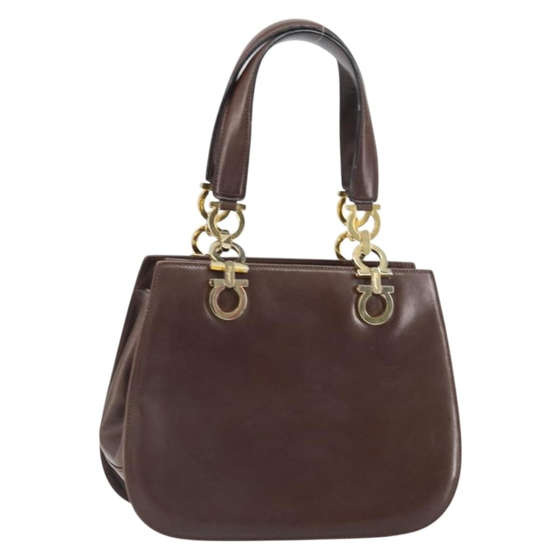 Brown Leather Gancini Handbag by Salvatore Ferragamo Gold Hardware Italy: Brown Leather Gancini Handbag by Salvatore Ferragamo Gold Hardware Italy This Salvatore Ferragamo Gancini handbag is crafted from brown leather and features gold-tone accents. Designed for women, it o
