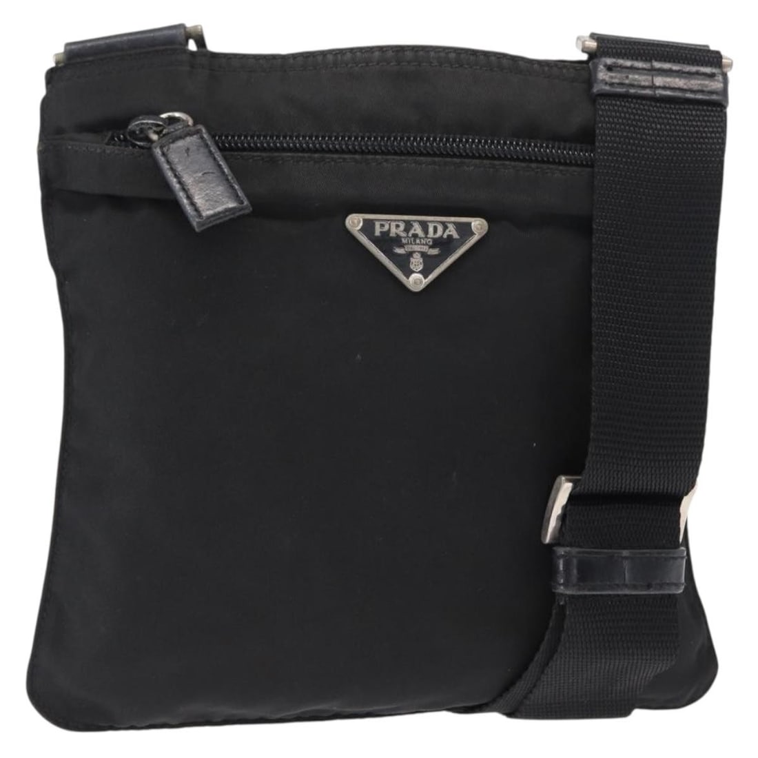 Prada black nylon women s shoulder bag Italy silver trim: Prada black nylon women s shoulder bag Italy silver trim This PRADA shoulder bag is crafted from black nylon with silver-tone accents, designed for women. Made in Italy, it features an adjustable shou
