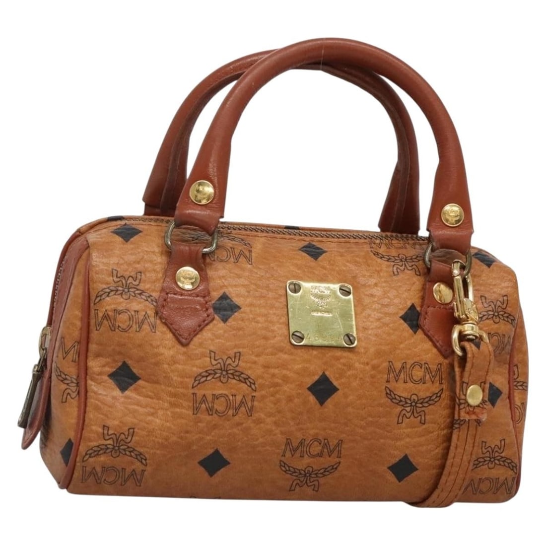 MCM Logogram Vicetos Brown Gold Hand Bag PVC Leather 2way Made in Germany: MCM Logogram Vicetos Brown Gold Hand Bag PVC Leather 2way Made in Germany Elevate your style with this authentic MCM Logogram Vicetos Hand Bag, crafted from durable PVC leather in a rich brown and gol