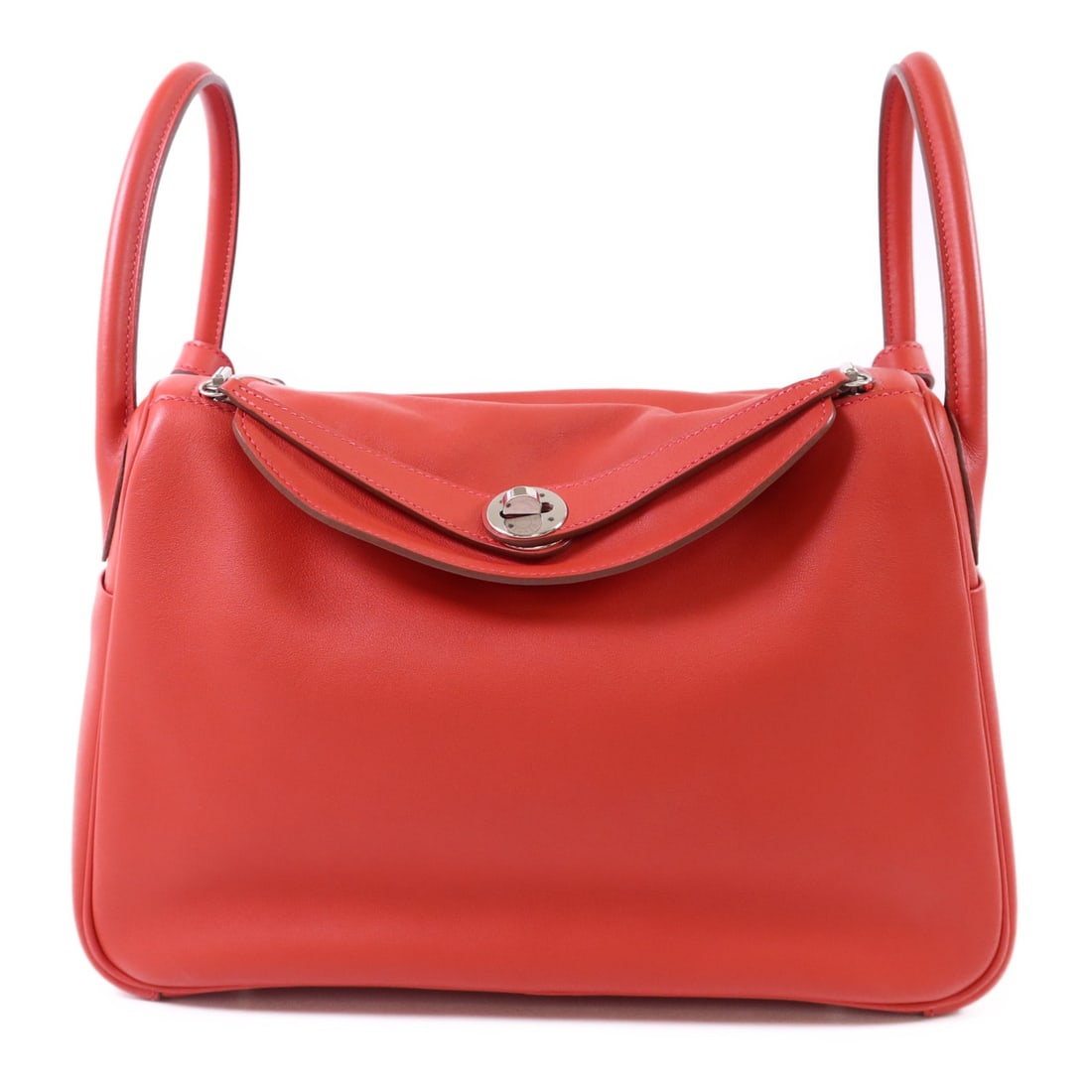 Red Evercolor Leather Lindy 30 Shoulder Bag by Hermes with Palladium Hardware: Red Evercolor Leather Lindy 30 Shoulder Bag by Hermes with Palladium Hardware This HERMES Lindy 30 is a versatile two-way shoulder bag crafted from Evercolor calfskin leather in a vibrant red hue. Mad