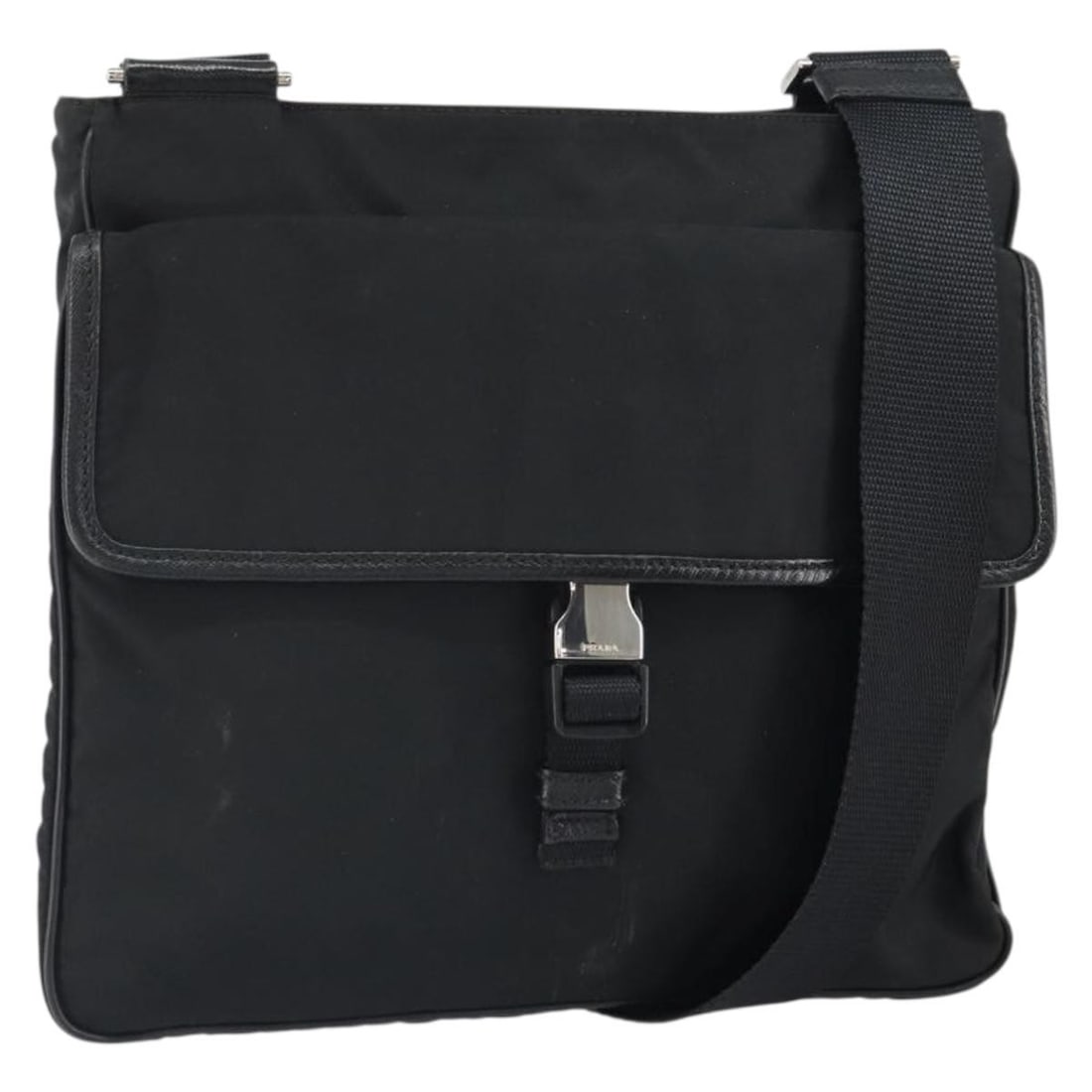 Prada Black Nylon Shoulder Bag with Silver Accents Made in Italy: Prada Black Nylon Shoulder Bag with Silver Accents Made in Italy This PRADA shoulder bag features a sleek black nylon exterior with silver-tone details. Made in Italy, the bag offers a practical desig
