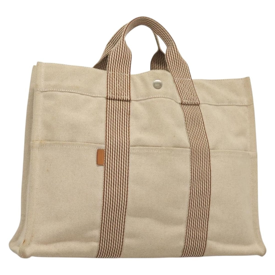 HERMES Fourre Tout MM Beige Silver Canvas Hand Bag Auth France: HERMES Fourre Tout MM Beige Silver Canvas Hand Bag Auth France This authentic HERMES Fourre Tout MM Hand Bag is a stylish accessory crafted in France from durable canvas. The exterior features a chic 