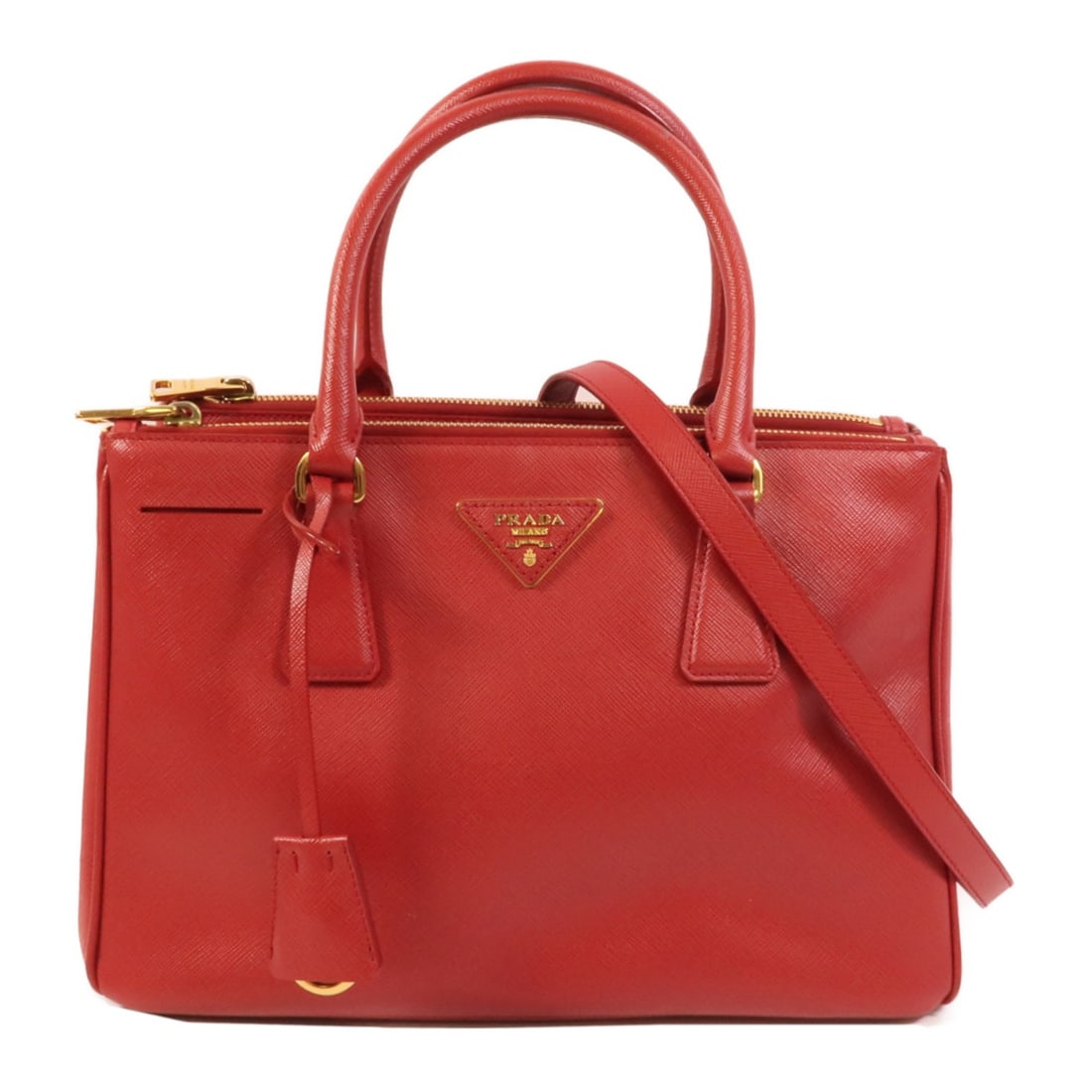 Prada Saffiano Leather Red 2way Shoulder Bag GHW: Prada Saffiano Leather Red 2way Shoulder Bag GHW This Prada 2-way shoulder bag is crafted from durable Saffiano leather in a striking red color. Designed for versatility, it can be carried as both a s