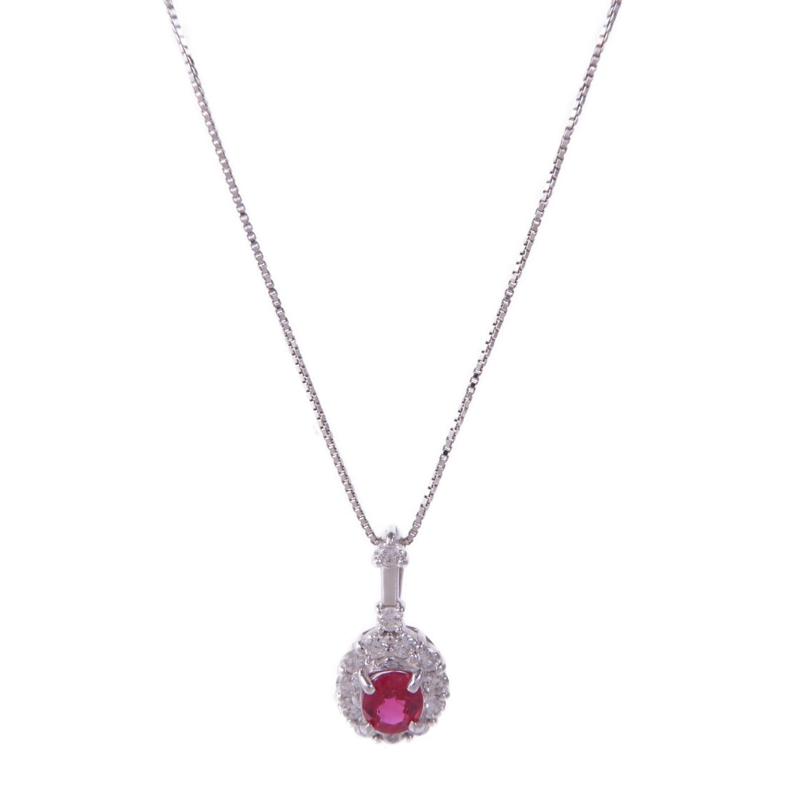 Ruby Diamond Necklace in 18K White Gold by JEWELRY: Ruby Diamond Necklace in 18K White Gold by JEWELRY This exquisite necklace features a stunning ruby set in 18K white gold, creating a striking contrast that enhances the vibrant red hue of the stone. 