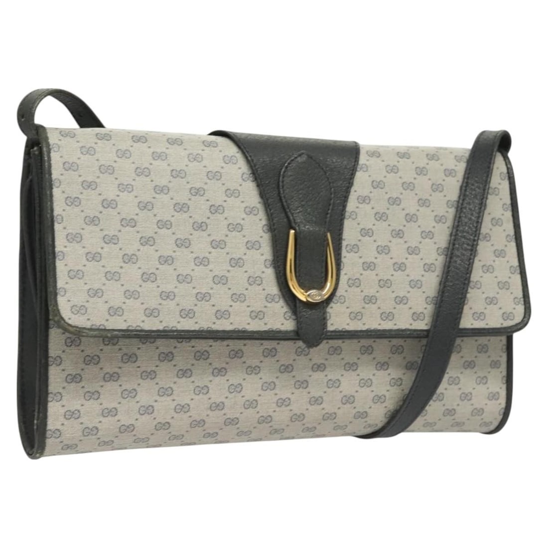 Gucci Navy Gold Micro GG Supreme Shoulder Bag: Gucci Navy Gold Micro GG Supreme Shoulder Bag This GUCCI Micro GG Supreme shoulder bag is crafted in Italy from navy and gold PVC leather with micro small GG canvas detailing. The bag features a struc