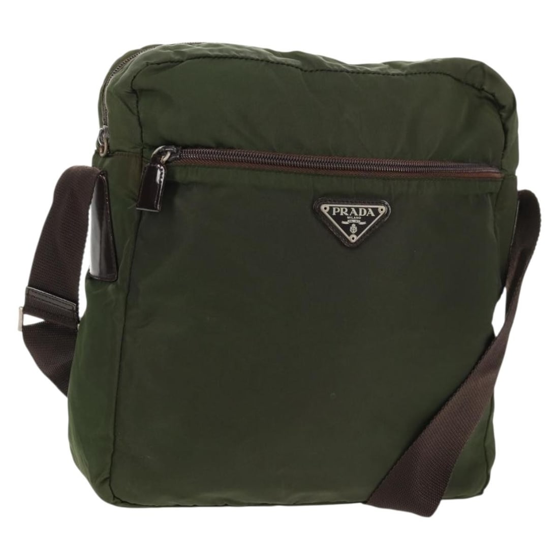 Prada Khaki Nylon Shoulder Bag Silver Trim Italy: Prada Khaki Nylon Shoulder Bag Silver Trim Italy This PRADA shoulder bag is crafted from khaki nylon with silver-tone accents. Designed for women, it features an adjustable shoulder strap for versatil