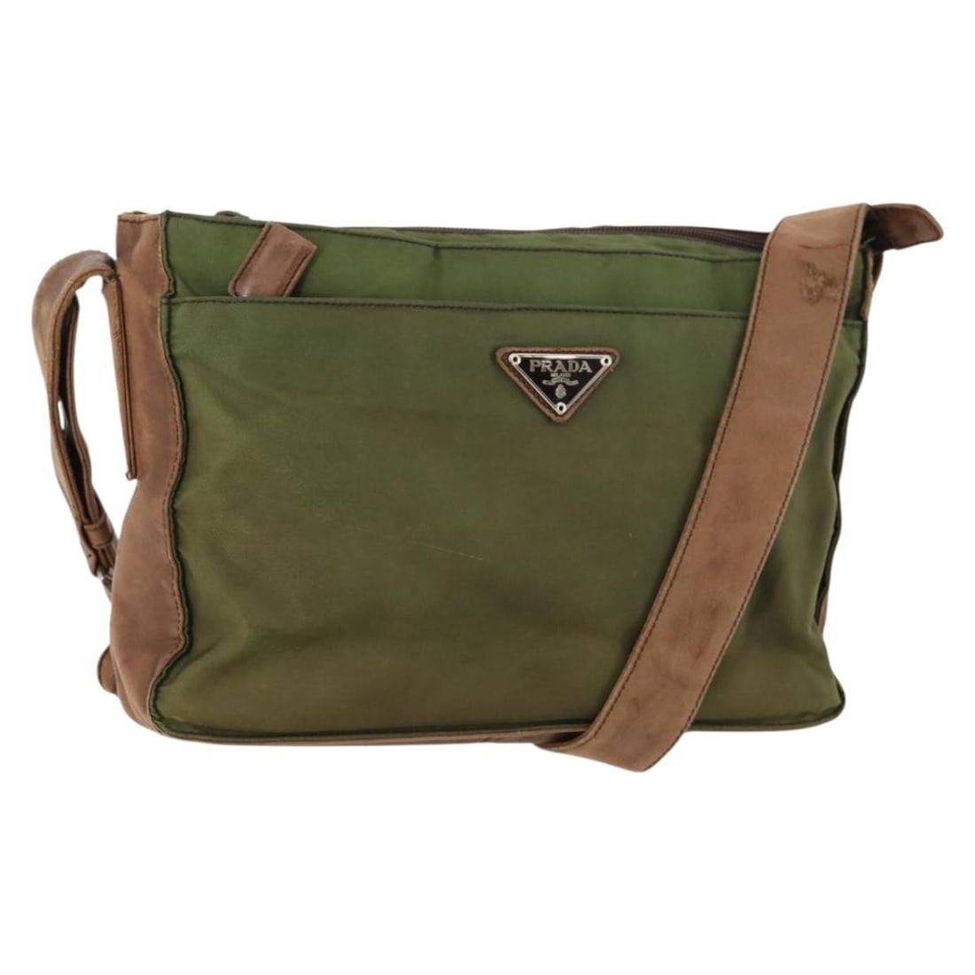 Prada Nylon Khaki Brown Silver Shoulder Bag Italy: Prada Nylon Khaki Brown Silver Shoulder Bag Italy This PRADA shoulder bag is crafted from durable nylon with leather accents in khaki, brown, and silver tones. Designed for women, it features a practi