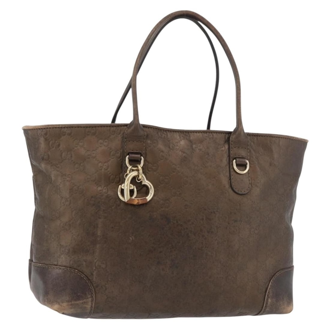 Gucci GG Canvas Brown Gold Bamboo Handbag Charm Italy: Gucci GG Canvas Brown Gold Bamboo Handbag Charm Italy This Gucci GG Canvas Guccissima Bamboo handbag features a brown and gold leather exterior with signature GG canvas detailing. The bag is designed 