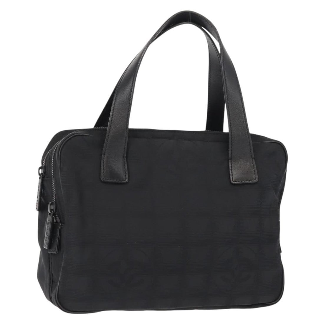 CHANEL Black Nylon Travel Hand Bag with Auth Card: CHANEL Black Nylon Travel Hand Bag with Auth Card Introducing the CHANEL New Travel Line Hand Bag, a sophisticated accessory crafted from durable nylon in a classic black color. This stylish hand bag 