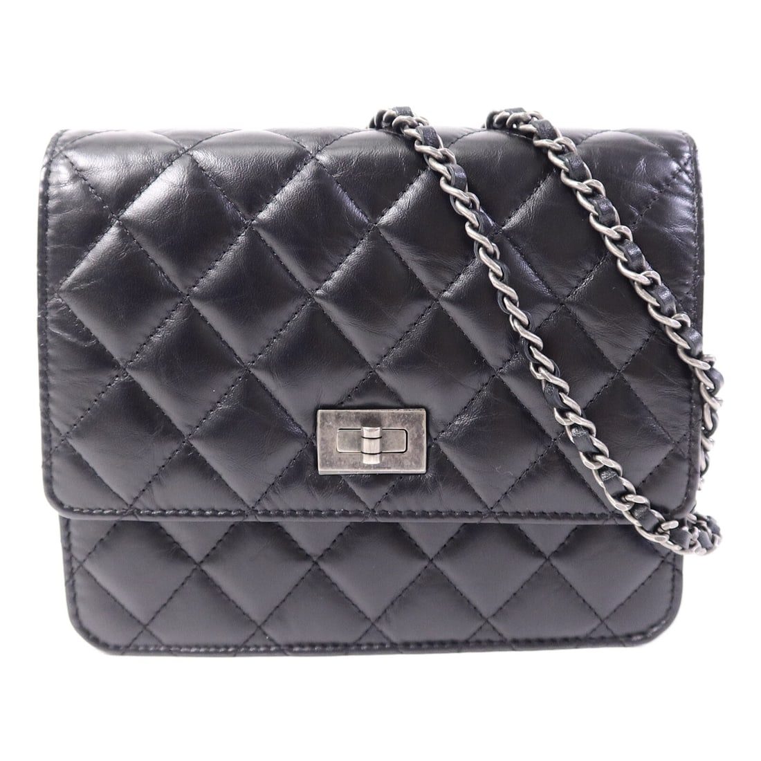 CHANEL 2.55 Reissue Black Calfskin Shoulder Bag: CHANEL 2.55 Reissue Black Calfskin Shoulder Bag This CHANEL CC 2.55 Reissue Chain Shoulder Bag features a classic black calfskin leather exterior and a sleek, compact design. Crafted for women, this s