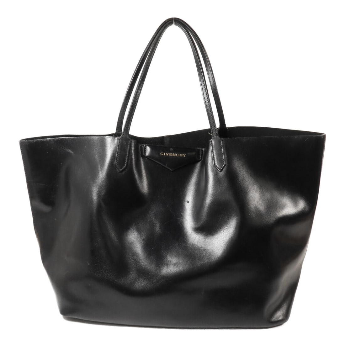 Givenchy Black Calfskin Women Tote Bag: Givenchy Black Calfskin Women Tote Bag This Givenchy tote bag is crafted from black calfskin leather, offering a spacious and functional design ideal for everyday use. Made in Italy, it features a cla