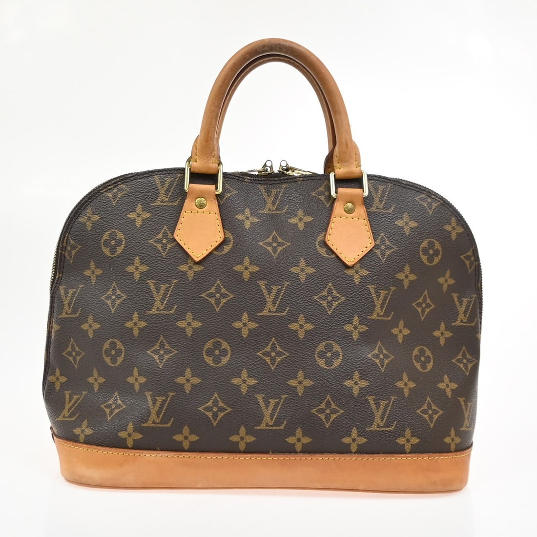 Louis Vuitton Alma Brown Monogram Canvas Tote: Louis Vuitton Alma Brown Monogram Canvas Tote This Louis Vuitton Alma Handbag features the iconic monogram canvas in brown, designed for women. Made in France, it offers a spacious interior and struct