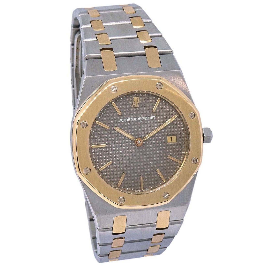 Audemars Piguet Royal Oak Quartz 33 mm Stainless Steel Yellow Gold Watch: Audemars Piguet Royal Oak Quartz 33 mm Stainless Steel Yellow Gold Watch This vintage Audemars Piguet Royal Oak Ref. 56143SA is a men's wristwatch featuring a quartz movement and a classic analog disp