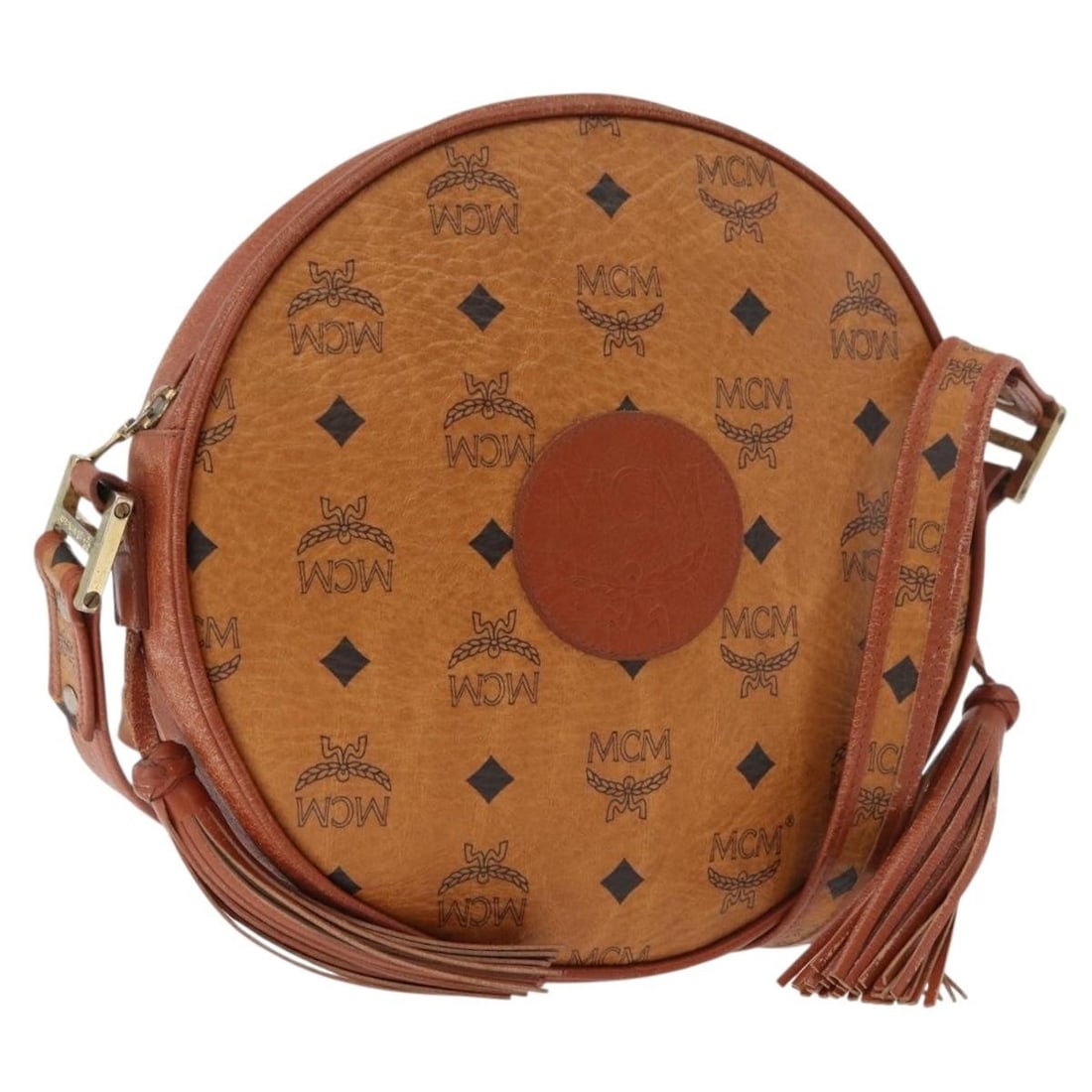 MCM Vicetos brown gold PVC shoulder bag Germany: MCM Vicetos brown gold PVC shoulder bag Germany This MCM Vicetos Logogram shoulder bag is crafted from durable PVC leather in a brown and gold color scheme. The bag features an adjustable shoulder str