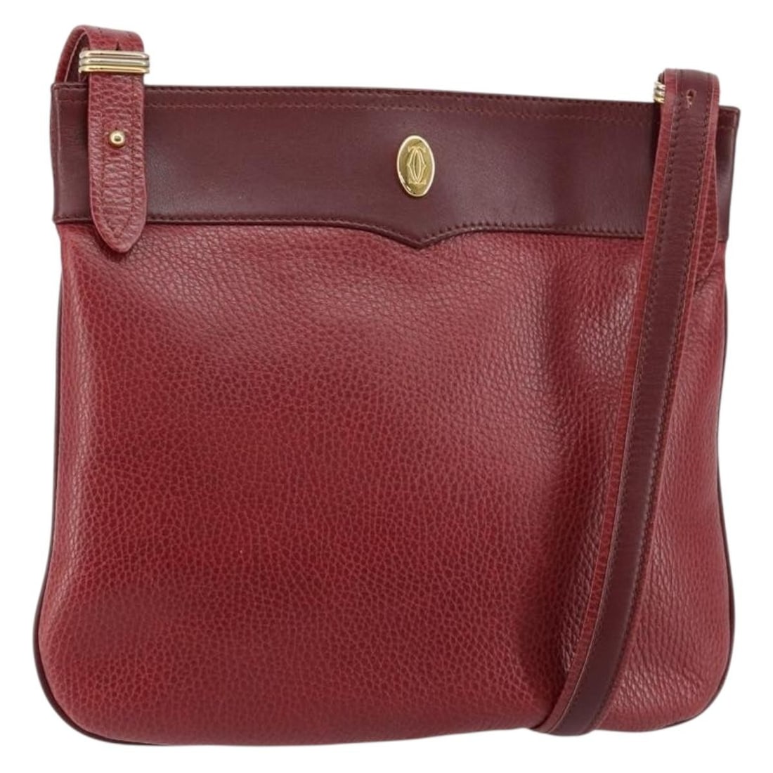 CARTIER Must Line Bordeaux Leather Shoulder Bag Gold Accents: CARTIER Must Line Bordeaux Leather Shoulder Bag Gold Accents This exquisite CARTIER Must Line Shoulder Bag showcases a refined bordeaux leather exterior accented with gold detailing. Crafted in France