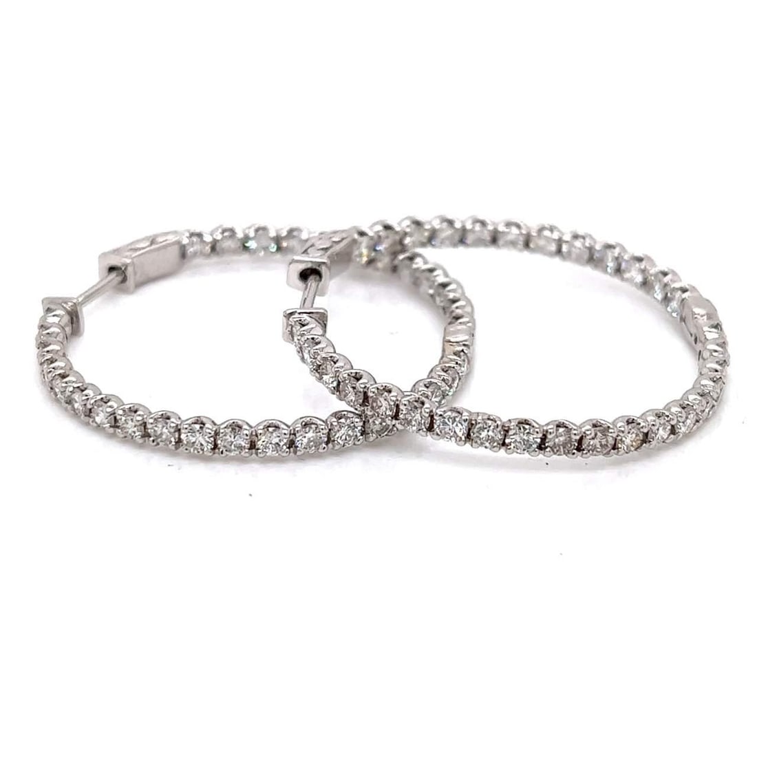 Stunning 14K White Gold 5.44 Ct Diamond Hoop Earrings 62 Stones: Stunning 14K White Gold 5.44 Ct Diamond Hoop Earrings 62 Stones These stunning 14K White Gold Hoop Earrings are adorned with a total of 62 brilliant diamonds, boasting a combined weight of 5.44 carats