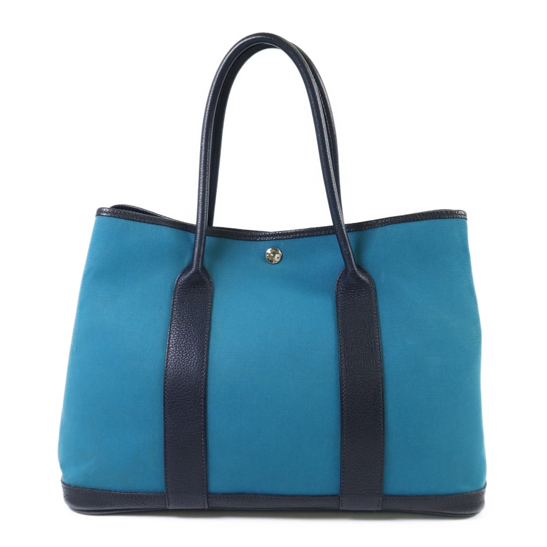Hermes Garden Party PM Blue Canvas Tote with Palladium Hardware: Hermes Garden Party PM Blue Canvas Tote with Palladium Hardware This Hermes Garden Party PM handbag features a blue canvas exterior and is designed for women. The bag is manufactured in France and is 
