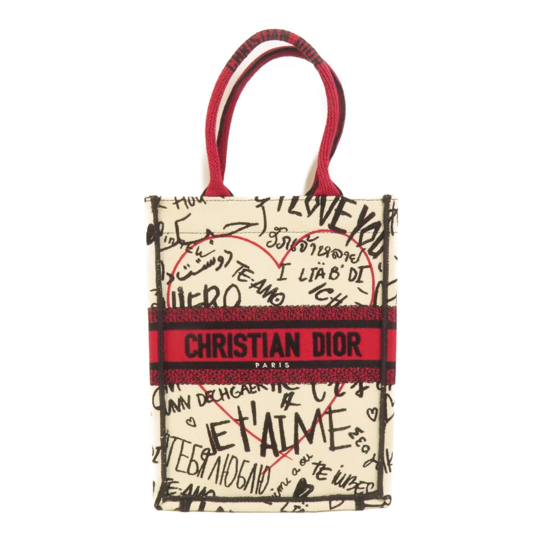 Dior CD Book Vertical Canvas Tote Bag White Red: Dior CD Book Vertical Canvas Tote Bag White Red This Christian Dior Book Tote Vertical Tote Bag features a stylish white and red canvas exterior. Designed for women, it offers a compact and versatile 