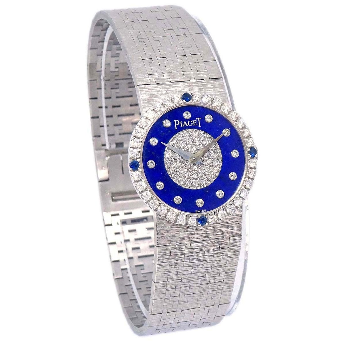 Piaget Tradition Blue Dial Diamond Accent White Gold Wristwatch: Piaget Tradition Blue Dial Diamond Accent White Gold Wristwatch This Piaget Tradition wristwatch, reference 9786A6, features a manual-winding mechanical movement. The watch showcases a striking blue l
