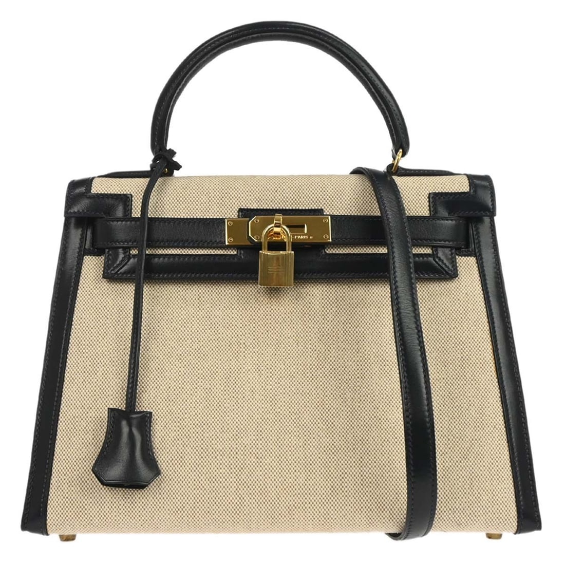 Hermes Kelly 28 Beige and Navy Leather Top Handle Satchel: Hermes Kelly 28 Beige and Navy Leather Top Handle Satchel This Hermes Kelly 28 Sellier handbag features a beige and navy toile H box calf leather exterior with a structured silhouette. It offers both 
