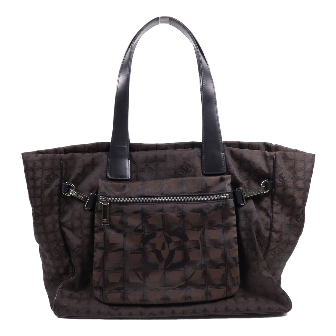 CHANEL Travel Line Brown Nylon Tote Bag: CHANEL Travel Line Brown Nylon Tote Bag This CHANEL Travel Line tote bag features a brown nylon exterior and is designed in a classic tote style. Made in France, it offers a spacious interior and a ve