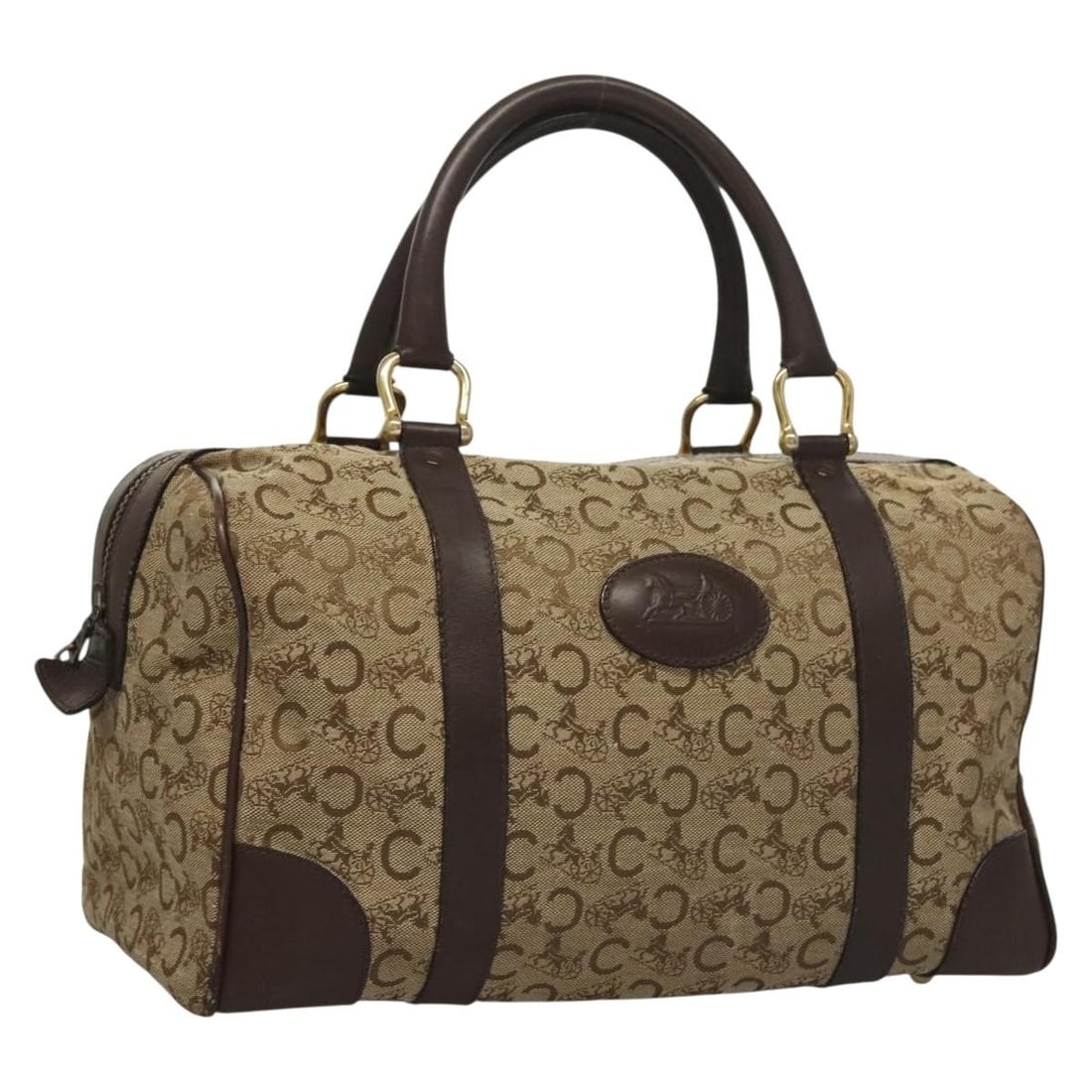 CELINE C Sulky Brown Gold Canvas Boston Bag: CELINE C Sulky Brown Gold Canvas Boston Bag This is a Celine C Sulky Boston Bag crafted in brown and gold canvas. Made in Italy, the bag features a classic Boston silhouette with dual handles and gold
