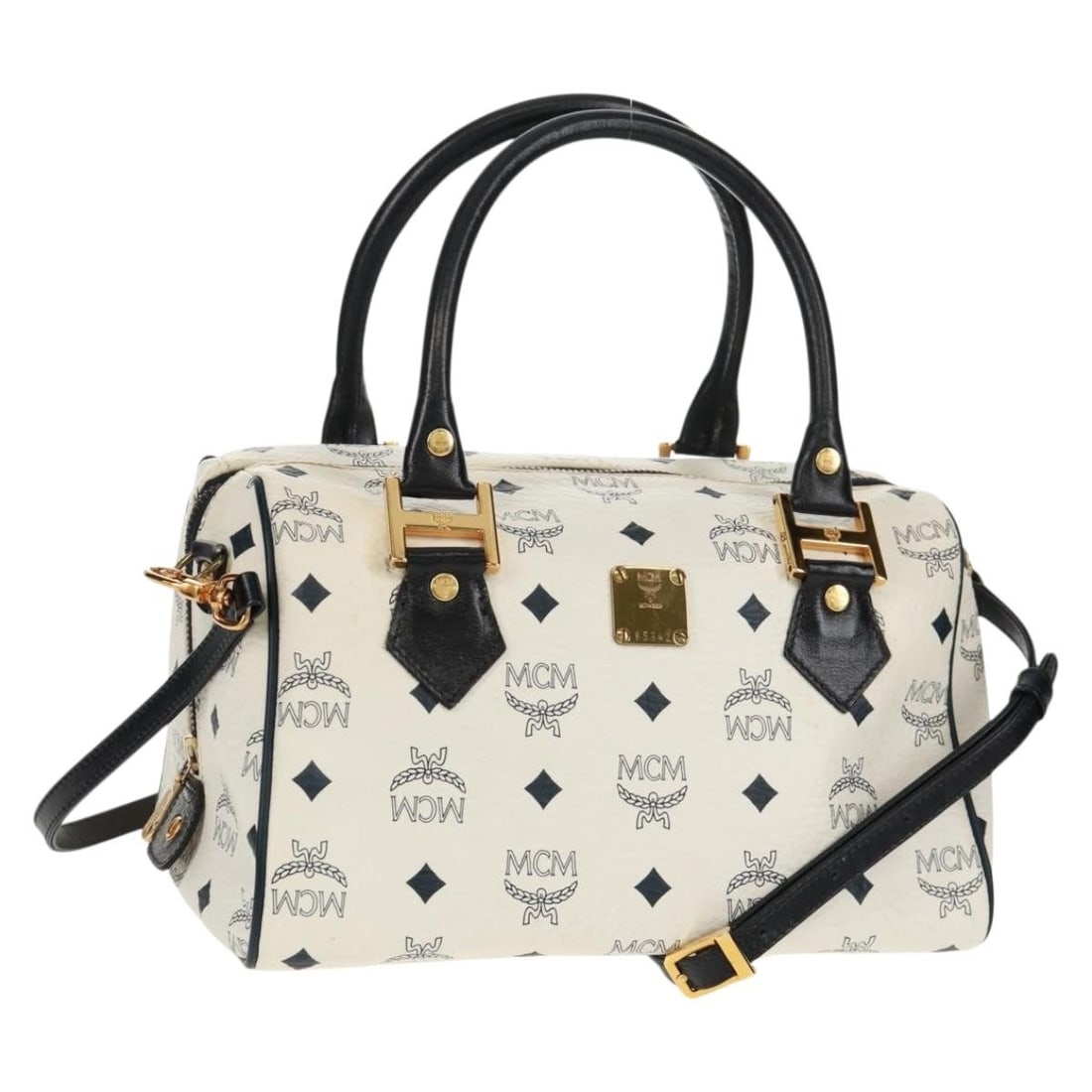 MCM Vicetos White Boston Bag PVC Leather Two Way Shoulder with Strap: MCM Vicetos White Boston Bag PVC Leather Two Way Shoulder with Strap This MCM Logogram Vicetos Boston Bag features a white and gold PVC leather exterior with both top handles and a detachable shoulder