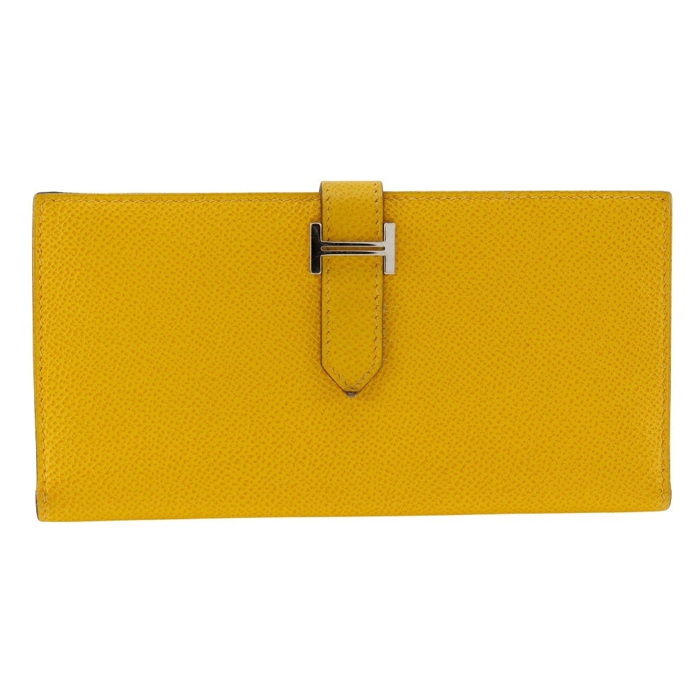 Yellow Leather Bearn Wallet by Hermes Unisex 17.5cm W: Yellow Leather Bearn Wallet by Hermes Unisex 17.5cm W Hermes Bearn Wallet crafted from yellow Epsom leather, designed for unisex use. It features a compact rectangular shape with minor signs of wear i