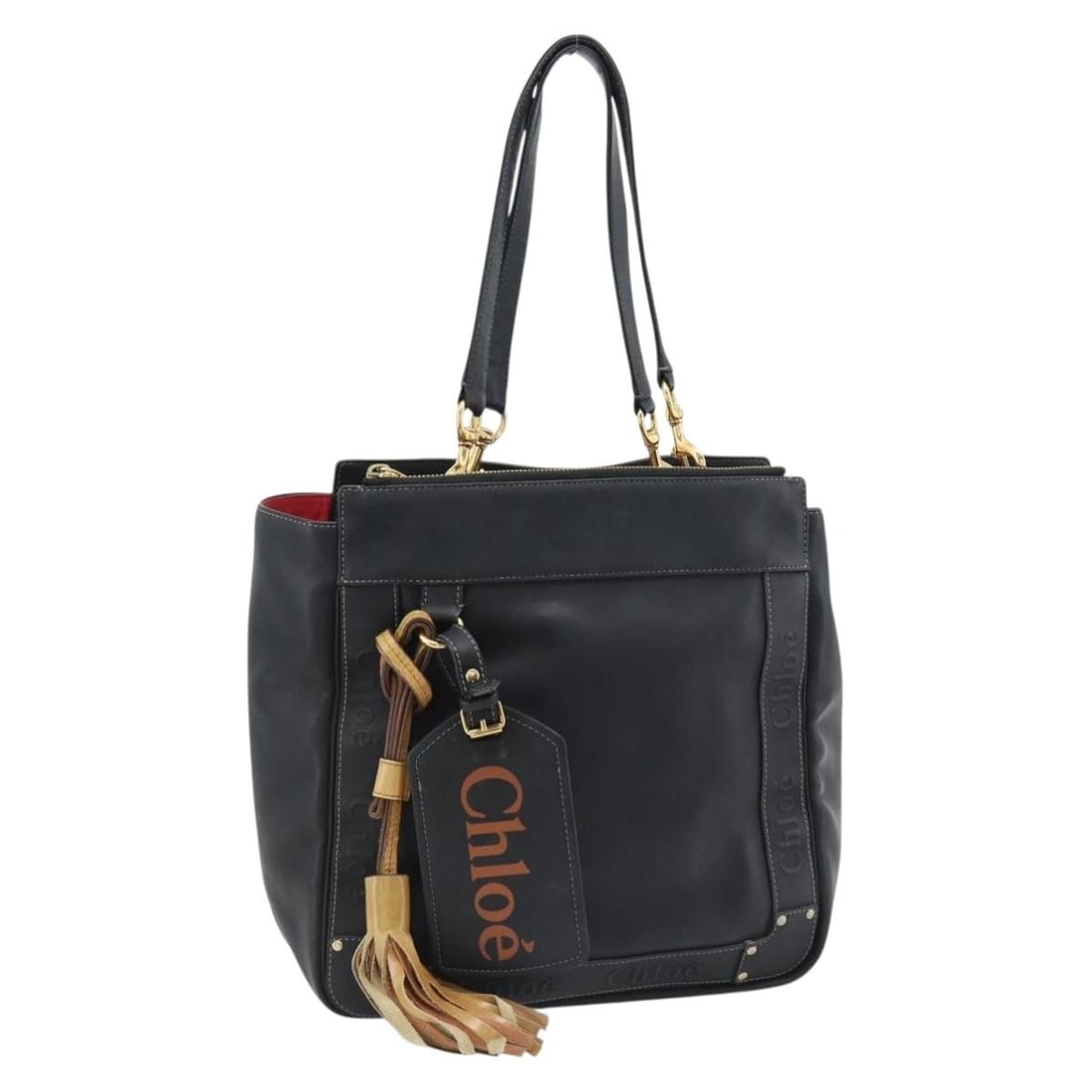 Chloe Black Gold Leather Tote Bag with Name Tag: Chloe Black Gold Leather Tote Bag with Name Tag This Chloe Eden tote bag is crafted from black and gold leather, offering a stylish and functional accessory for everyday use. The bag features a spacio