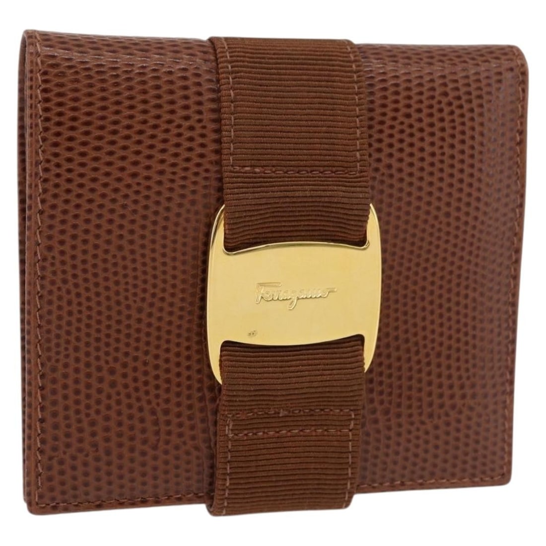 Salvatore Ferragamo Vala Brown Gold Leather Wallet: Salvatore Ferragamo Vala Brown Gold Leather Wallet This Salvatore Ferragamo Vala wallet is crafted from brown leather with gold-tone accents. Designed for women, it features a compact form with approx