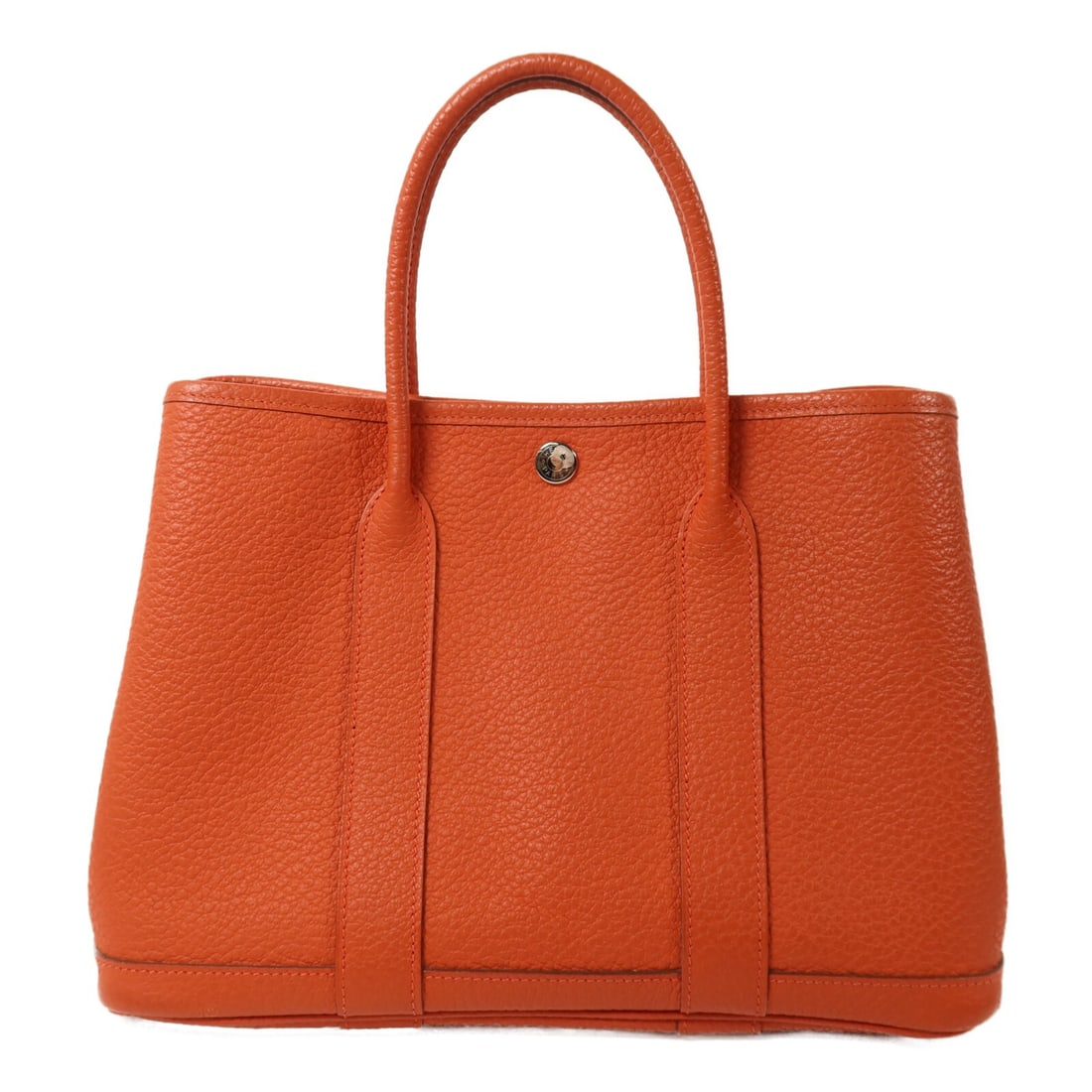 Hermes Garden Party TPM Orange Calfskin Tote with Palladium Hardware: Hermes Garden Party TPM Orange Calfskin Tote with Palladium Hardware This HERMES Garden Party TPM tote bag is crafted from Negonda calfskin leather in a vibrant orange shade. Designed for women, it fe