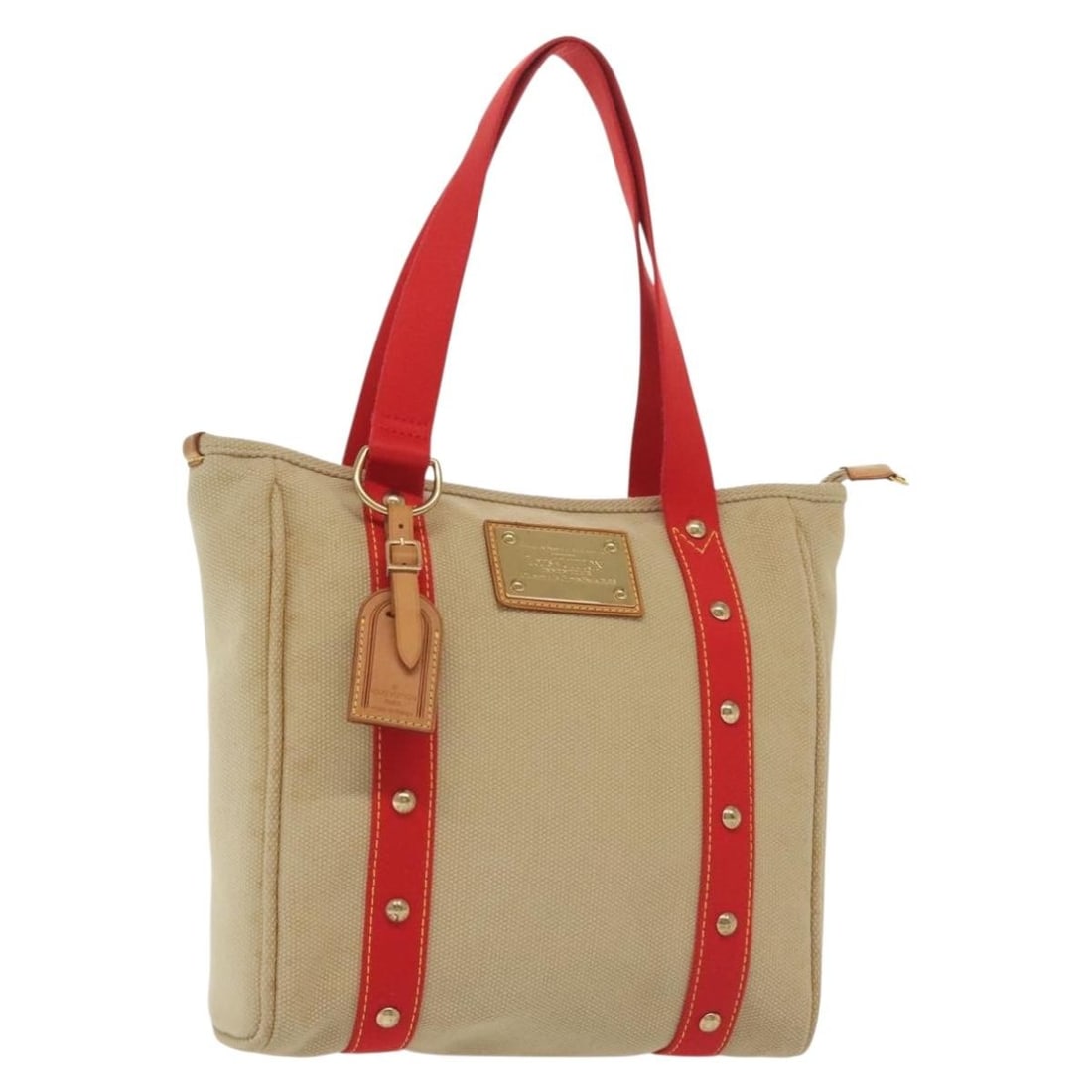 Louis Vuitton Antigua Cabas MM Beige Red Canvas Tote M40035: Louis Vuitton Antigua Cabas MM Beige Red Canvas Tote M40035 This Louis Vuitton Antigua Cabas MM tote bag features a beige and red canvas exterior with an approximate size of 11.4 inches in length, 11.
