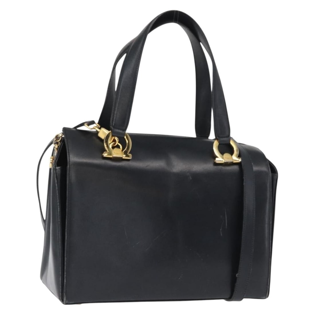 Ferragamo Gancini Navy Leather Two Way Shoulder and Handbag with Gold Accents: Ferragamo Gancini Navy Leather Two Way Shoulder and Handbag with Gold Accents This Salvatore Ferragamo Gancini handbag is crafted from navy leather with gold-tone accents and is designed for versatile