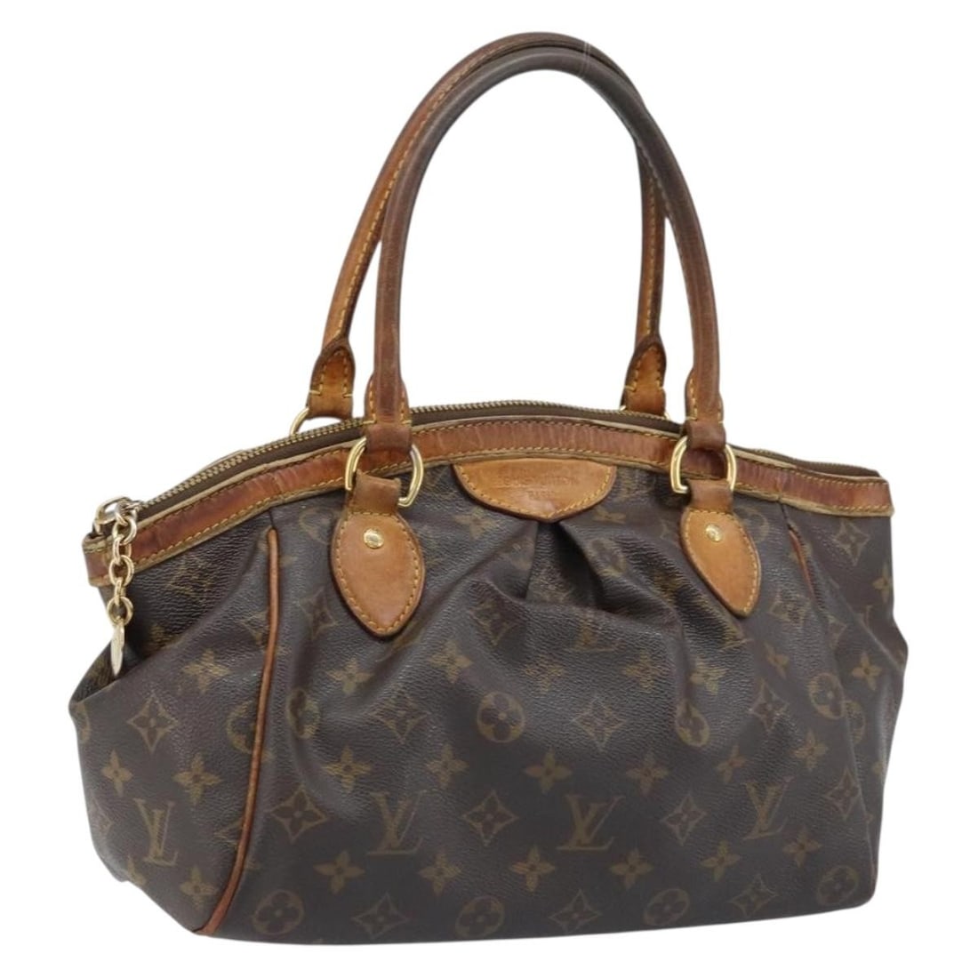 Louis Vuitton Tivoli PM Monogram Canvas Handbag M40143 France: Louis Vuitton Tivoli PM Monogram Canvas Handbag M40143 France This Louis Vuitton Monogram Tivoli PM handbag features the signature monogram canvas and is designed for women. Made in France, the bag of