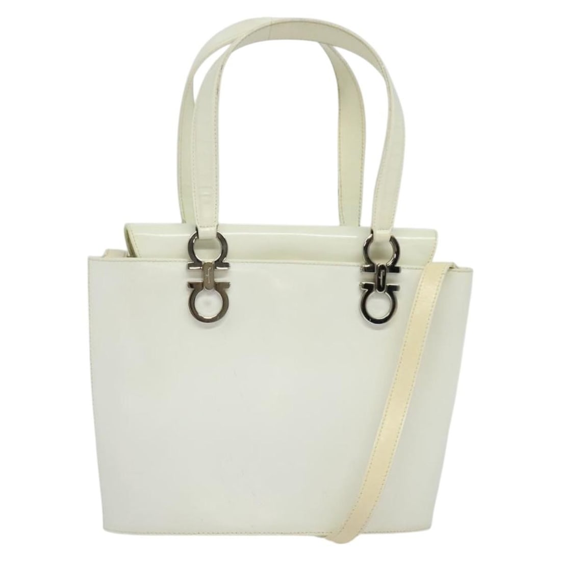 White Patent Leather Gancini Shoulder and Top Handle Bag by Salvatore Ferragamo: White Patent Leather Gancini Shoulder and Top Handle Bag by Salvatore Ferragamo This Salvatore Ferragamo Gancini handbag features a white and silver patent leather exterior and offers versatile carryi
