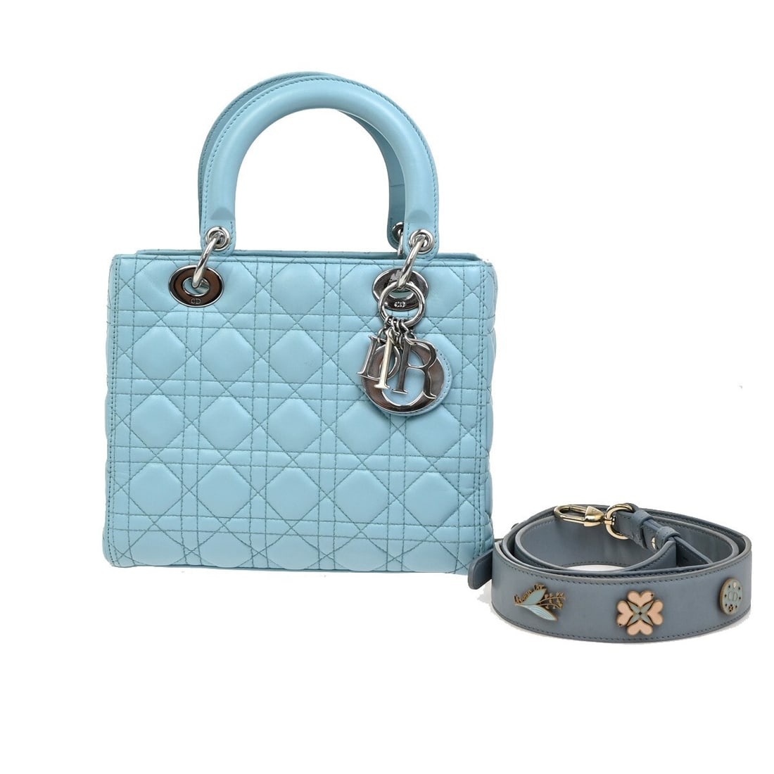 Christian Dior Lady Dior blue leather handbag: Christian Dior Lady Dior blue leather handbag This Christian Dior Lady Dior bag is crafted from blue leather and showcases the iconic design associated with the brand. Made in Italy, it features a str