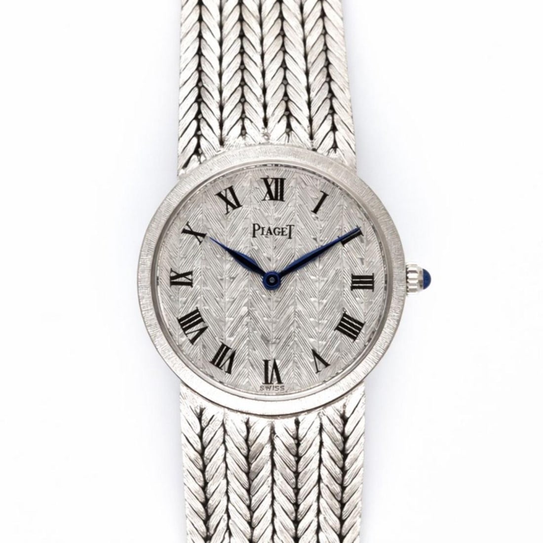 Piaget Ladies 18K White Gold Manual Wind Watch 24mm 7.5 in: Piaget Ladies 18K White Gold Manual Wind Watch 24mm 7.5 in This Piaget ladies watch features an 18K white gold case and bracelet, weighing 59.8 grams. The watch has a 24mm case and is powered by a man