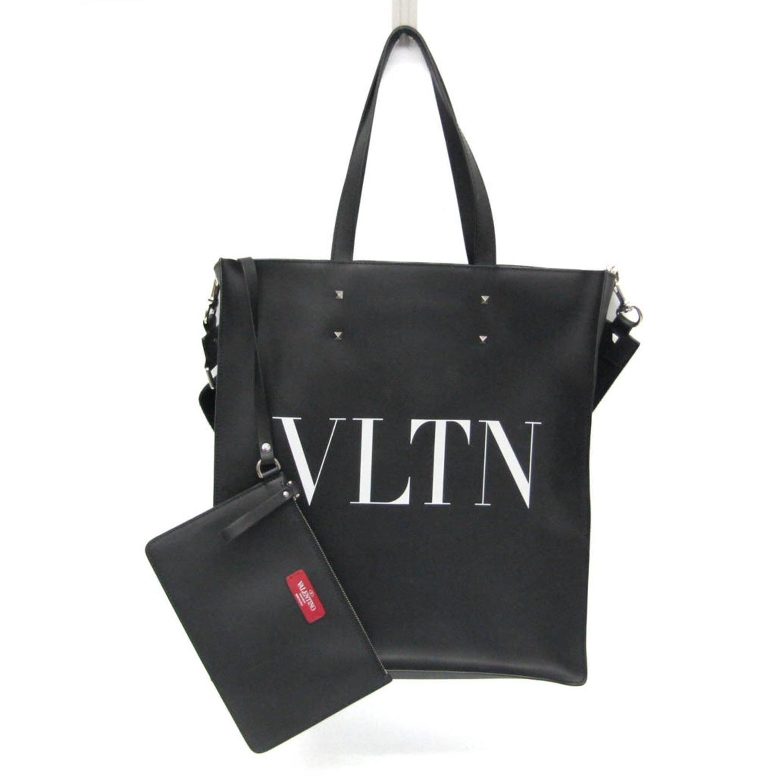 Valentino Garavani Black Leather VLTN Tote Bag for Women: Valentino Garavani Black Leather VLTN Tote Bag for Women This Valentino Garavani VLTN Tote is crafted from black leather and designed for women. The tote features a spacious interior, making it suitab