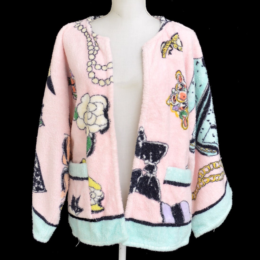Chanel #38 Pink Cotton Long Sleeve Open Front Cardigan: Chanel #38 Pink Cotton Long Sleeve Open Front Cardigan Elevate your casual wardrobe with this stylish Chanel cardigan. Crafted from 100% cotton, this long sleeve cardigan features a classic round neck