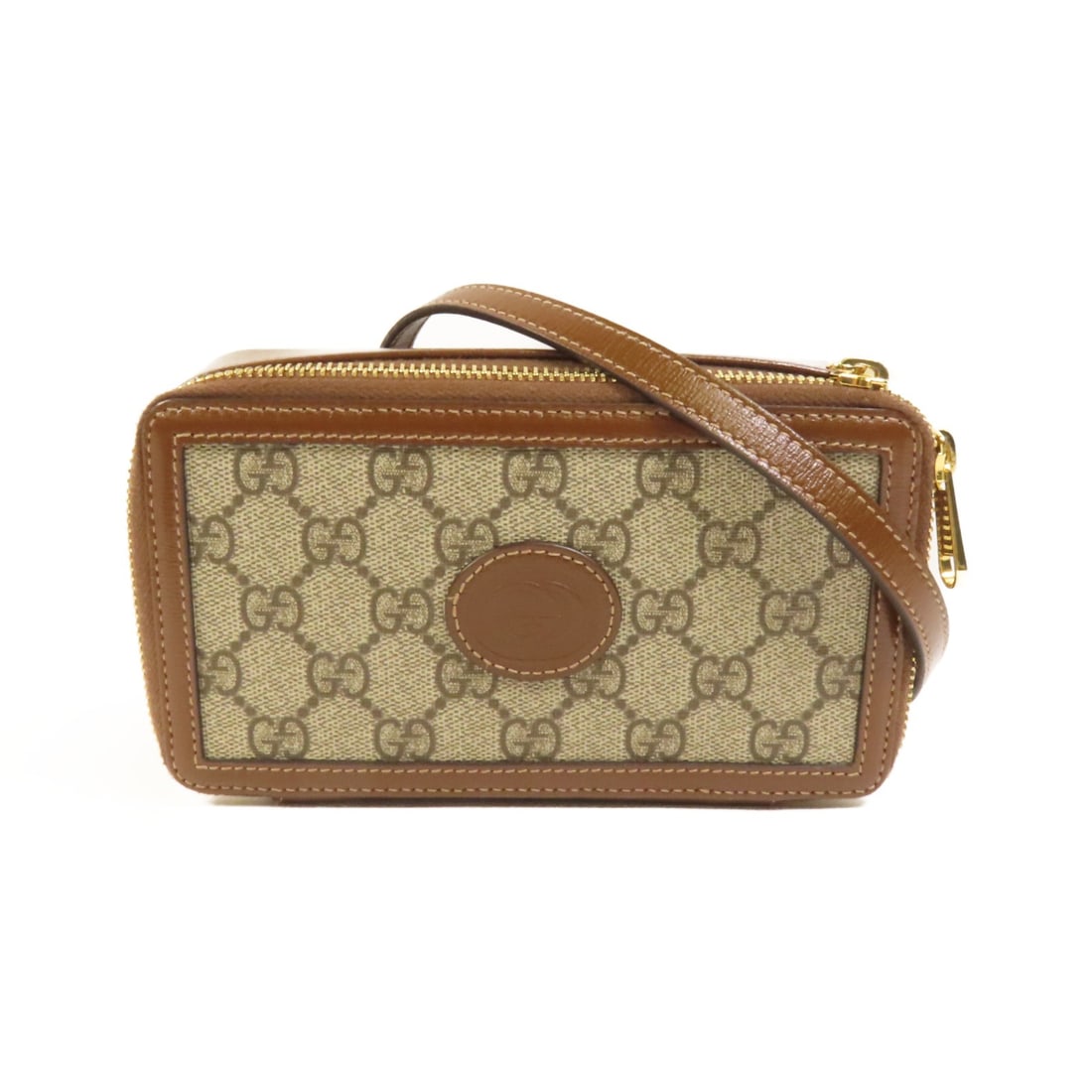 Gucci GG Supreme Brown Shoulder Bag with Gold Hardware in Coated Canvas: Gucci GG Supreme Brown Shoulder Bag with Gold Hardware in Coated Canvas This GUCCI GG Supreme shoulder bag features a brown PVC coated canvas exterior with calfskin detailing. Designed in a classic sh
