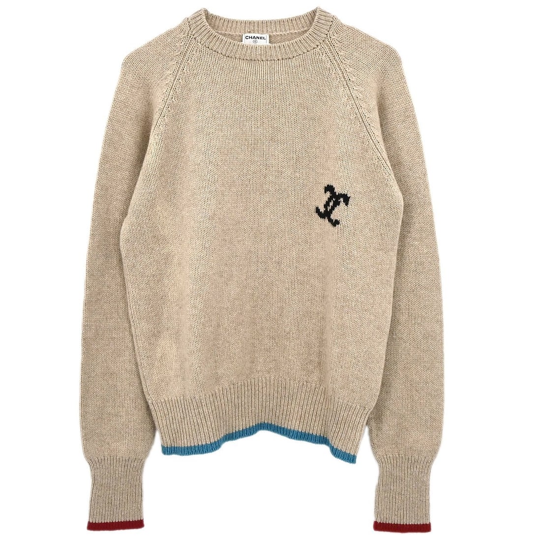 Beige Cashmere Knit Long Sleeve Top by Chanel Size 44: Beige Cashmere Knit Long Sleeve Top by Chanel Size 44 This vintage Chanel knit top is crafted from 100% cashmere in a classic beige color. Featuring long sleeves and a round neckline, it offers a regu