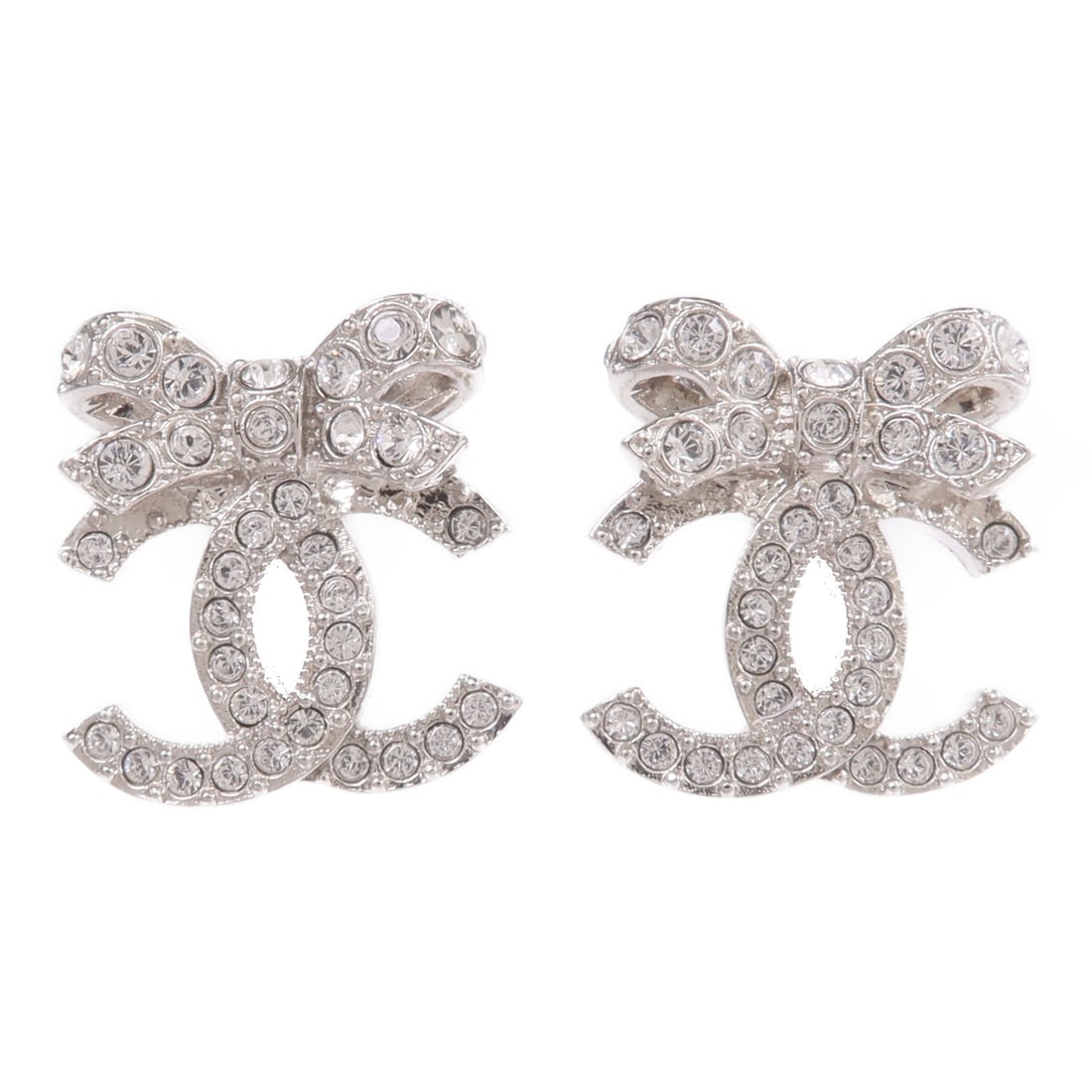 Chanel Silver Tone CC Logo Pierced Earrings for Women: Chanel Silver Tone CC Logo Pierced Earrings for Women These CHANEL CC pierced earrings feature a silver-tone metal design with a clear accent. Crafted for women, they are made in France and do not inc