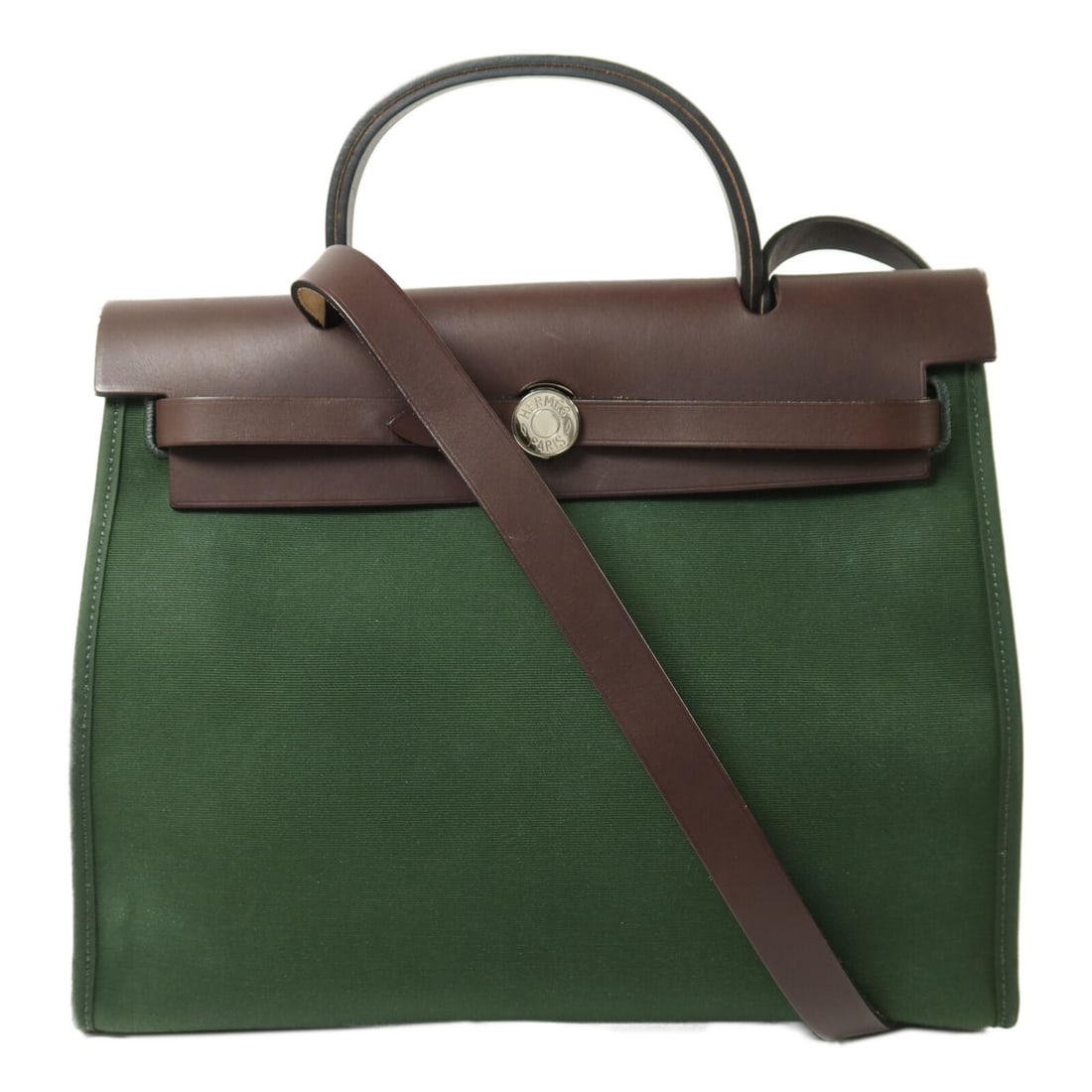 Herbag PM Canvas Green Shoulder Bag with Palladium Hardware by Hermes: Herbag PM Canvas Green Shoulder Bag with Palladium Hardware by Hermes This Hermes Herbag PM is a versatile 2-way shoulder bag crafted from green canvas, designed for women. The bag features a practica