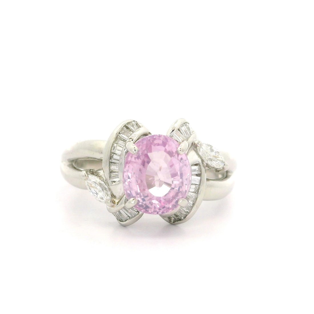 Platinum GIA Certified 2.99ct Oval Pink Sapphire Baguette Diamond Ring: Platinum GIA Certified 2.99ct Oval Pink Sapphire Baguette Diamond Ring This exquisite cocktail ring showcases a stunning 2.66ct natural oval-cut pastel pink sapphire, beautifully prong set to highligh