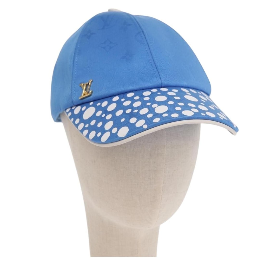 Blue Monogram Canvas Cap by Louis Vuitton and Yayoi Kusama Infinity Dot M7068M: Blue Monogram Canvas Cap by Louis Vuitton and Yayoi Kusama Infinity Dot M7068M This Louis Vuitton Monogram Yayoi Kusama Infinity Dot Cap features a blue monogram canvas design inspired by the renowned