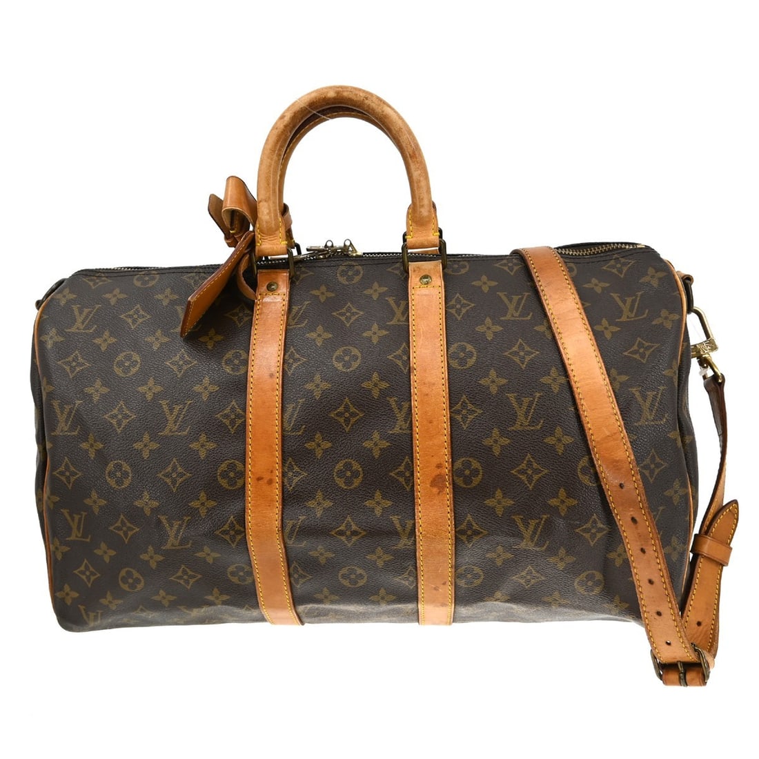 Louis Vuitton Monogram Canvas Keepall Bandouliere Bag: Louis Vuitton Monogram Canvas Keepall Bandouliere Bag This Louis Vuitton Keepall Bandouliere Bag features the classic Monogram Canvas design in brown. Designed for unisex use, it offers spacious stora